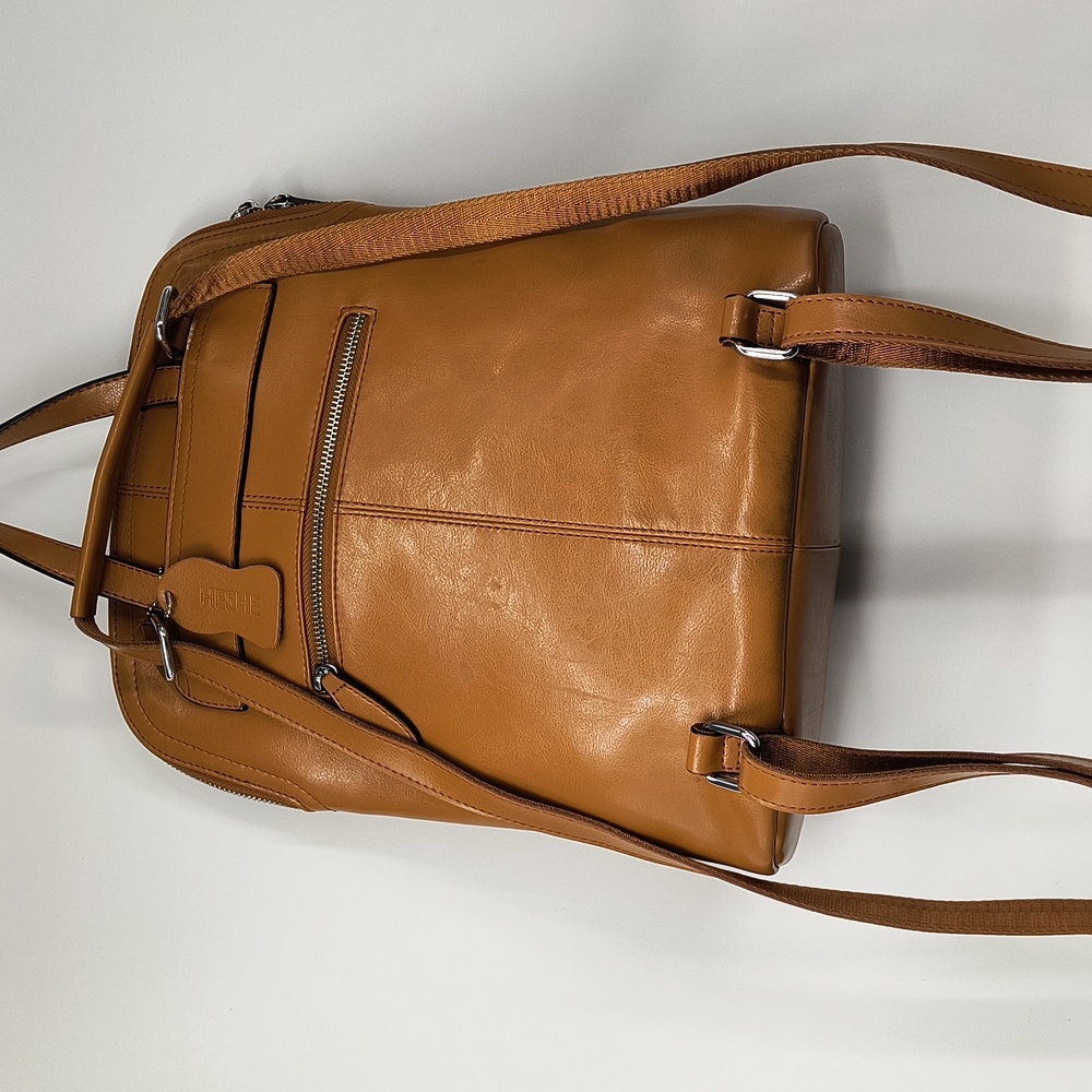 Heshe brown leather backpack-11 x 13 x 4 1/4 inches.